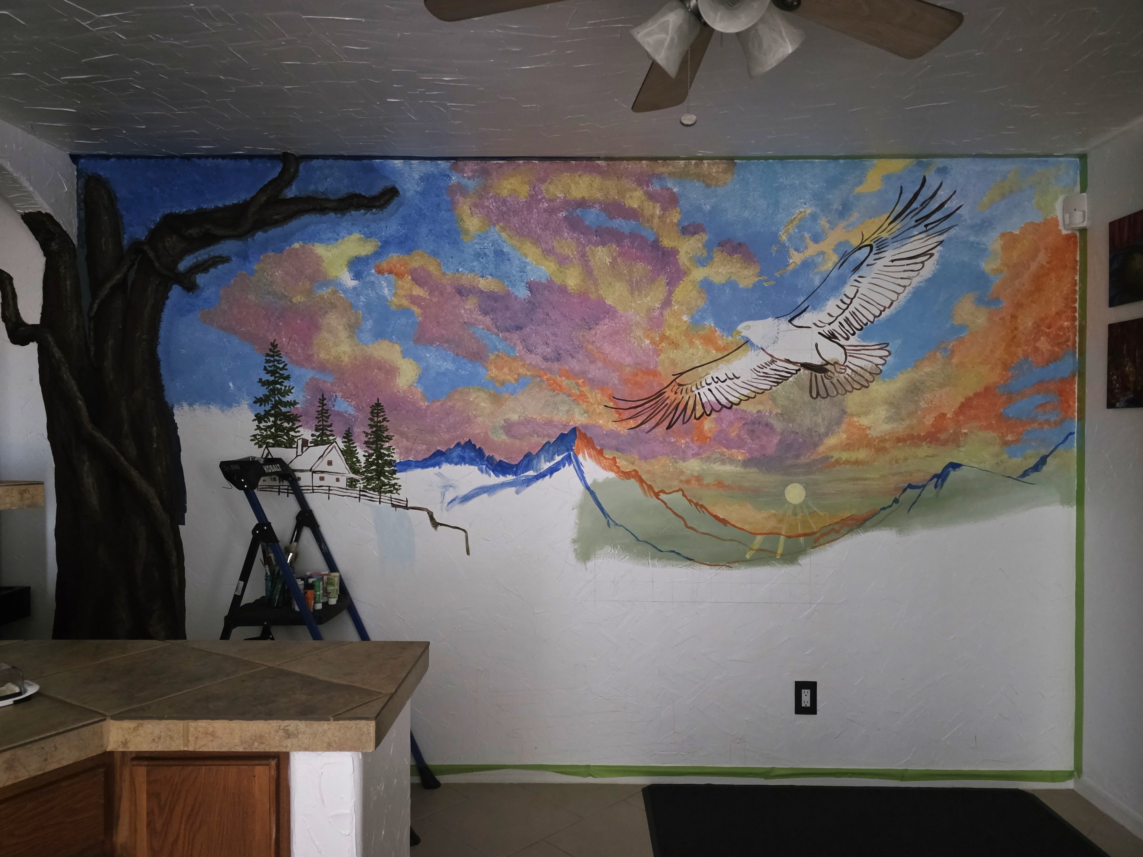 Custom mountain and eagle mural in progress